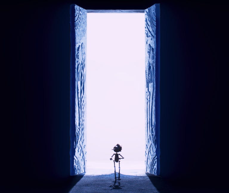 Pinocchio silhouetted in a massive doorway