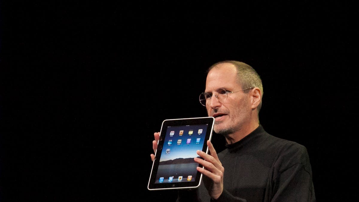 Steve Jobs shows off the first iPad in 2010.