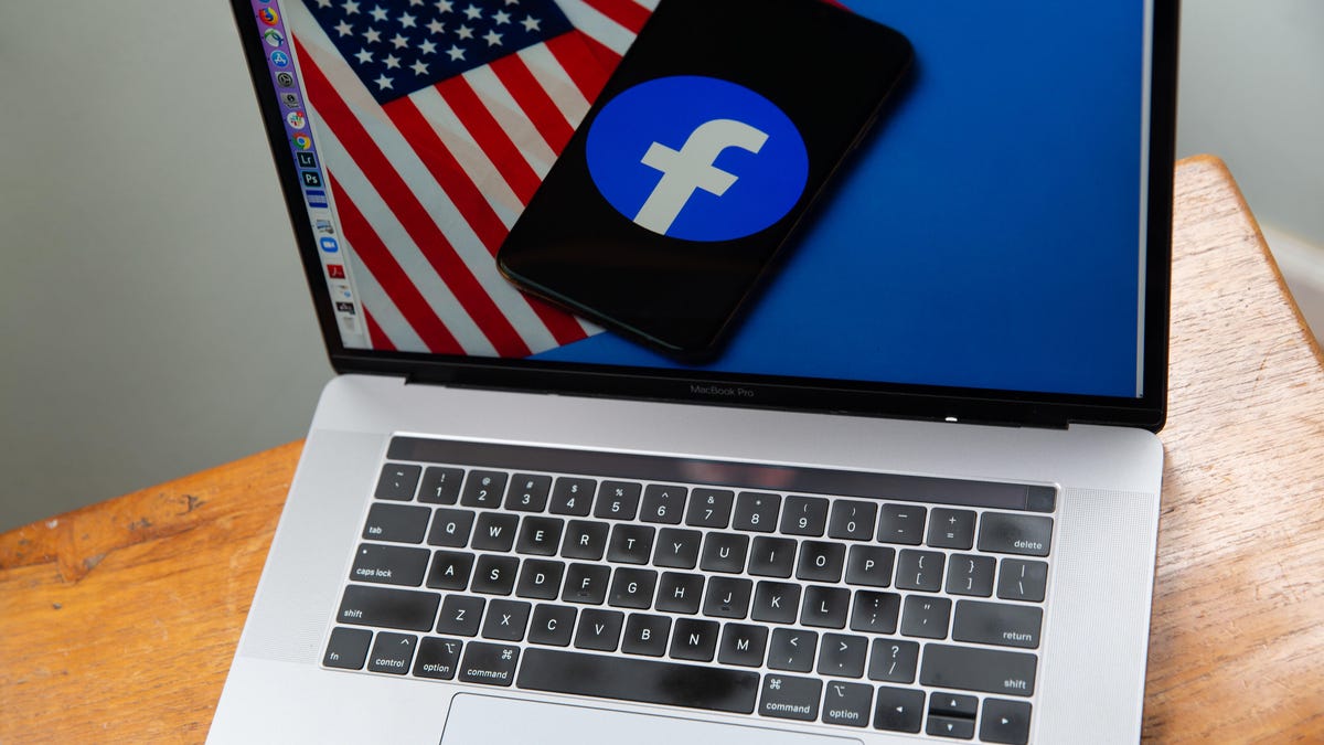 Facebook logo and US flag on a laptop screen
