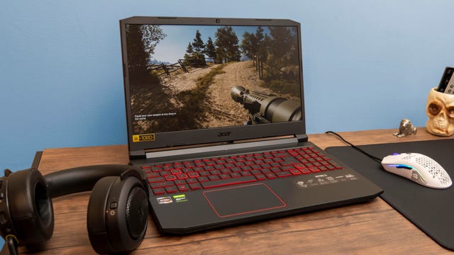 Acer Nitro 5 laptop on desk with headphones