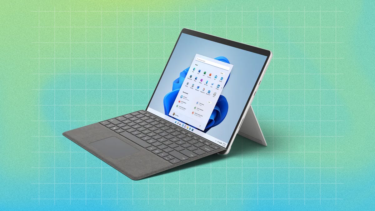 Surface Pro 9 on a turquoise background
