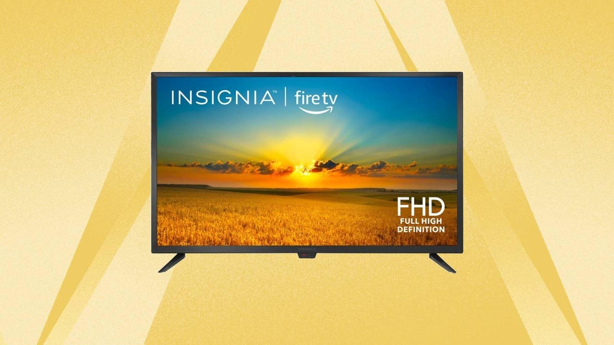 An Insignia TV against a yellow background.