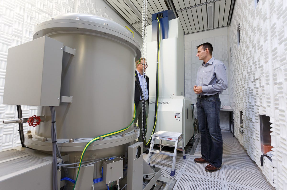 Rolf Erni, head of the Electron Microscopy Center at the Empa materials science research center, talks to a reporter next to a massive transmission electron microscope that can observe structures as detailed as individual atoms and chemical bond types.