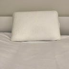 Sijo Support Pillow on a white bed
