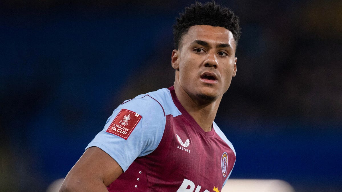 Aston Villa's Ollie Watkins looks over his right shoulder towards the camera.