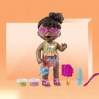 A baby alive doll in pink sunglasses