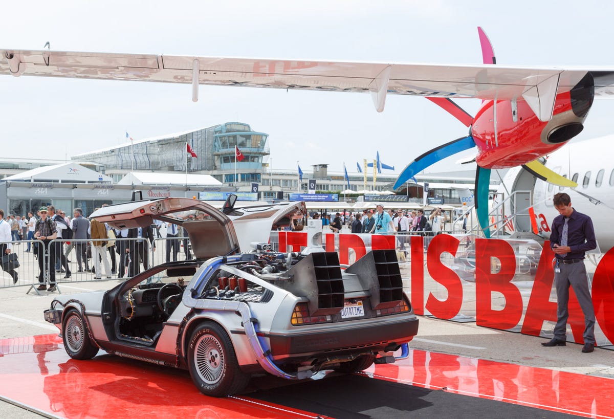 A "Back to the Future" DeLorean is used to draw crowds to a display at the Paris Air Show.