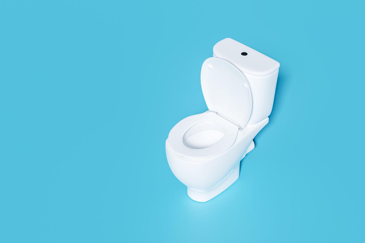 White toilet on a bright blue background