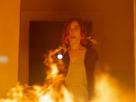 <p>Carly Pope menaced by flames in 2021 movie Demonic</p>