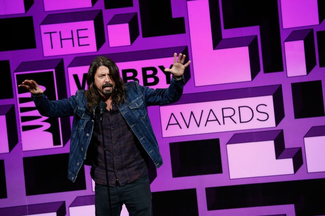 Musician Dave Grohl presents an award at the 19th annual Webby Awards in May.