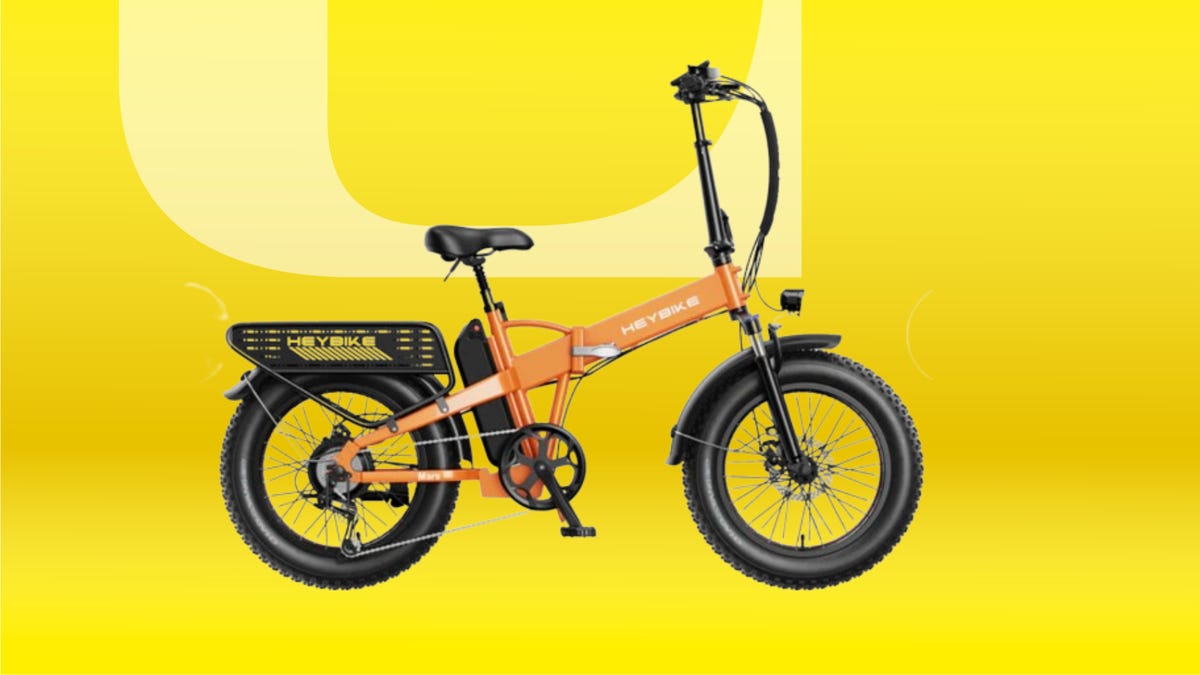 HeyBike Mars 2.0 eBike with orange accents against bright yellow background