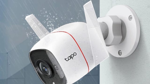 The Tapo C310 camera mounted on outside trim with graphics of rain falling on it.
