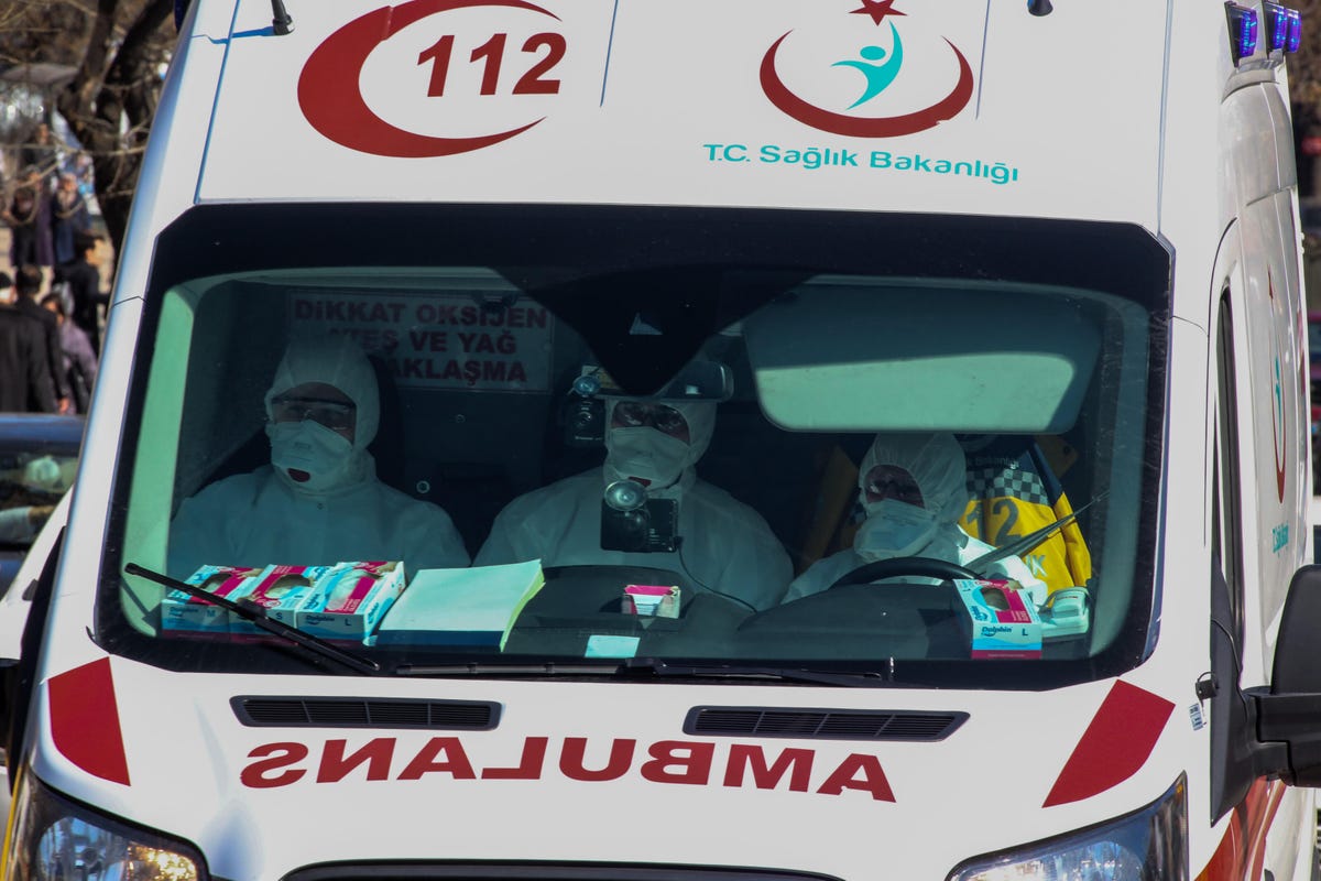 An ambulance in Turkey with health personnel in protective gear