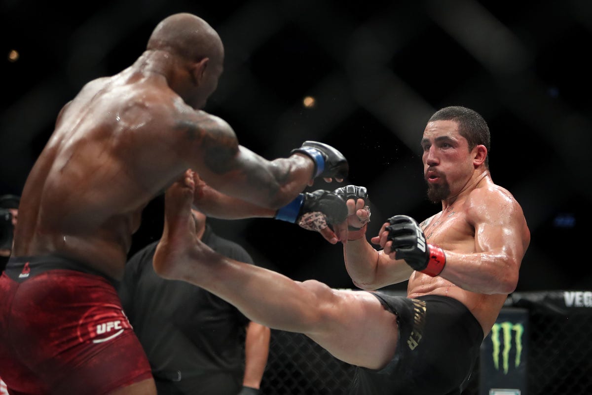 Robert Whittaker (right) in his incredible fight against Yoel Romero at UFC 225 on June 9.
