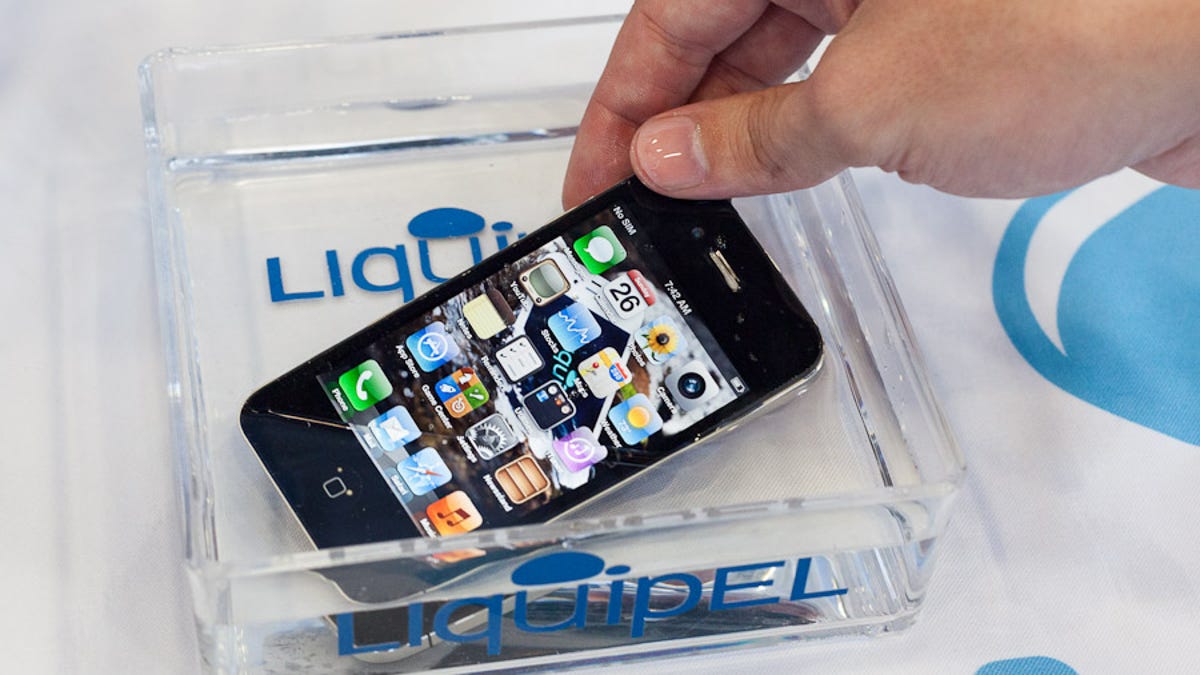 Liquipel showed an iPhone treated to survive full immersion in this tray of water at Mobile World Congress.