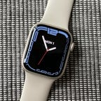 The Apple Watch Series 7 with a white strap.
