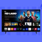A Vizio smart TV against a blue/purple background.
