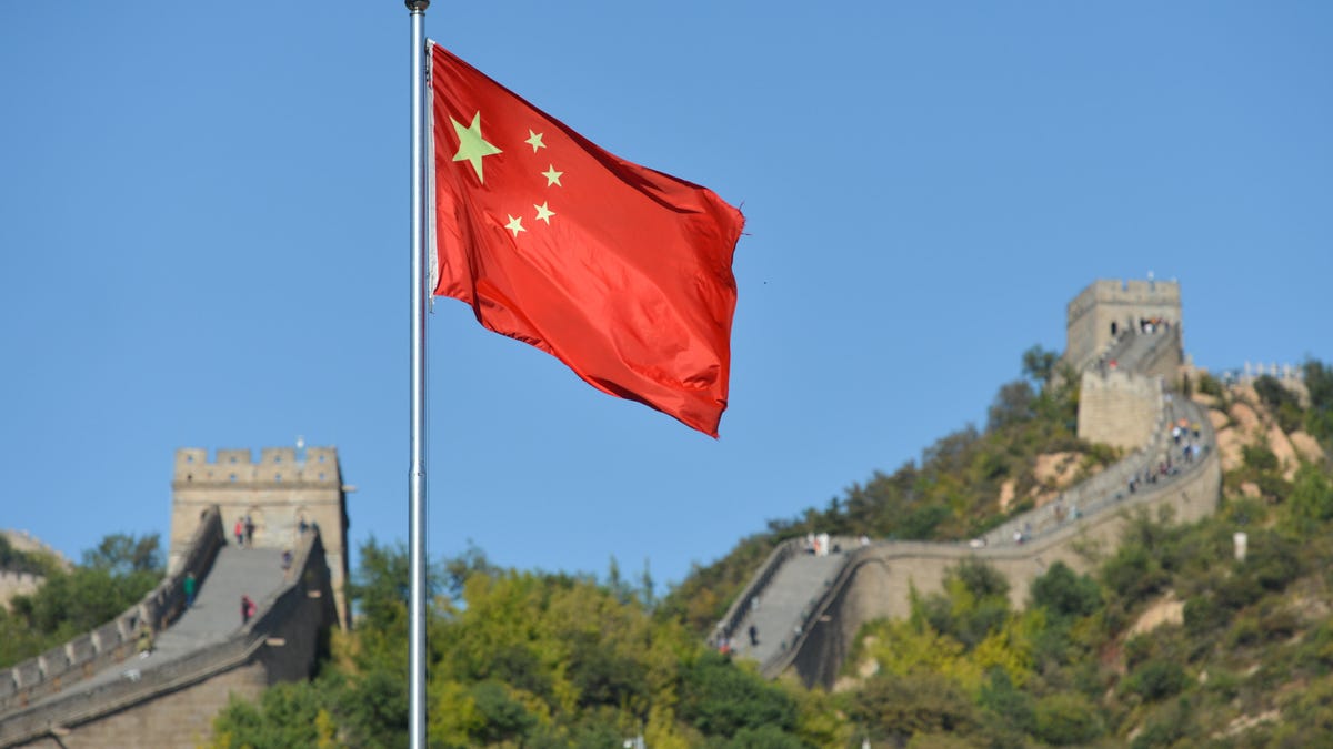 China's flag in front of the Great Wall