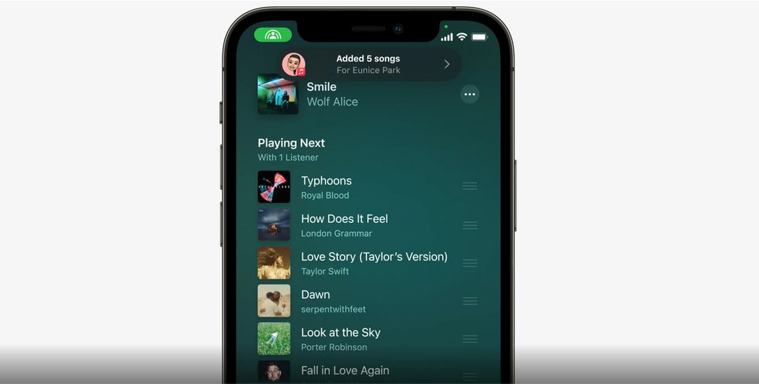 iPhone using SharePlay and showing a music playlist