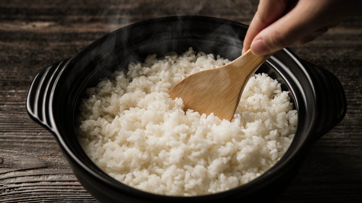 Steaming hot rice in a pot