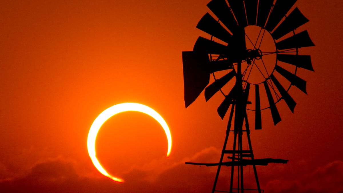 Annular solar eclipse in the background of a windmill in Lubbock, Texas.