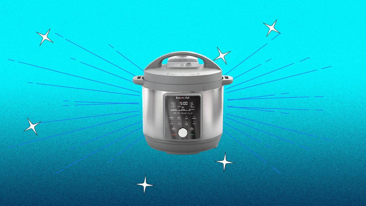 A grey Instant Pot multi-cooker against a blue background.
