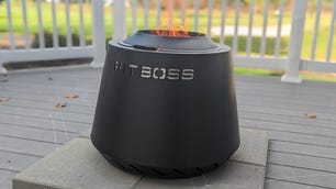 Black fire pit with Pit Boss cut out of the side