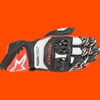 Alpinestars GP Pro R3 Gloves on an orange background