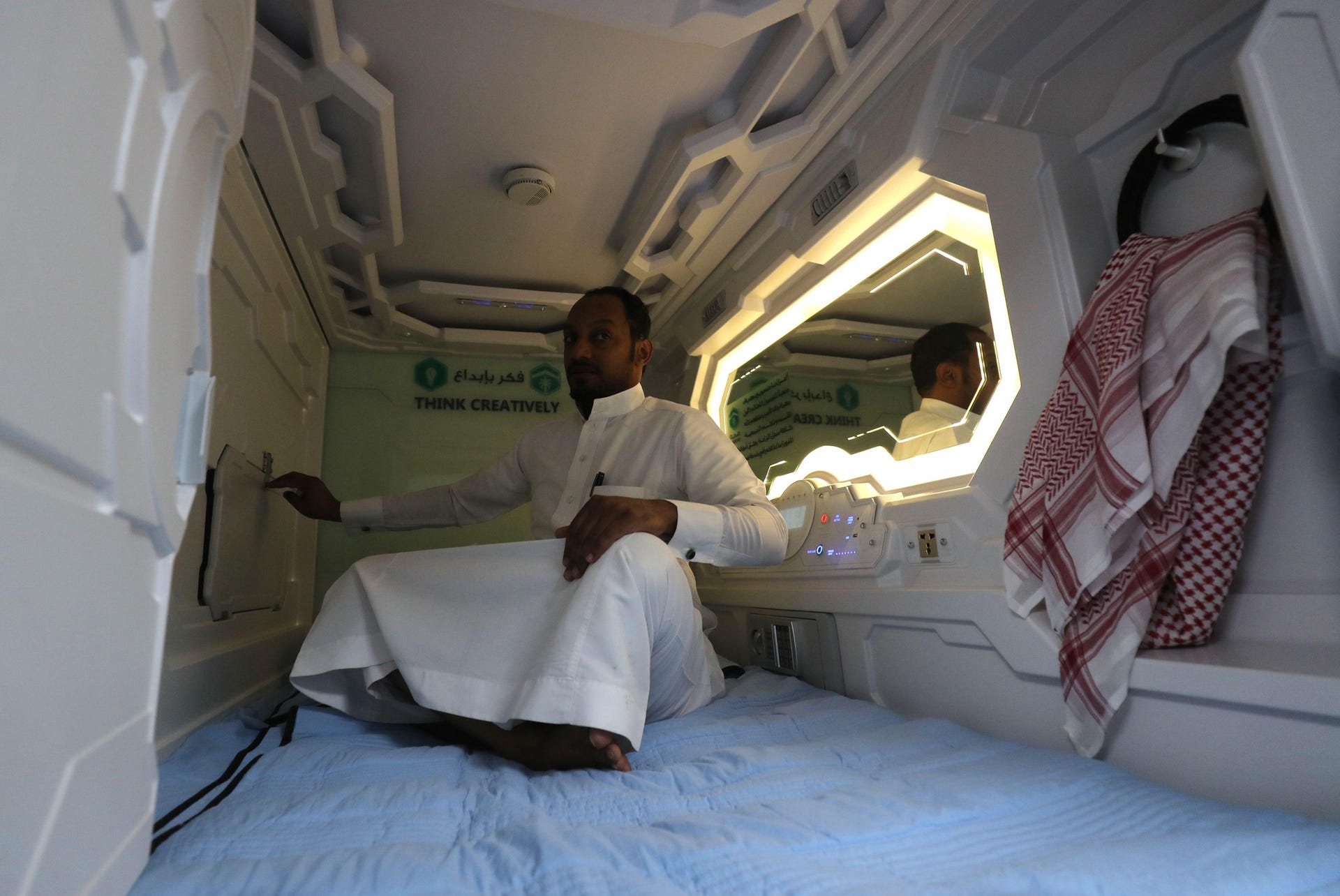 A Saudi man sits inside a sleep pod in Mecca.