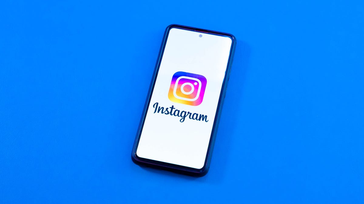 Instagram logo on a smartphone with blue background