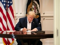 <p>An Oct. 3 photo shows President Donald Trump at Walter Reed hospital.</p>