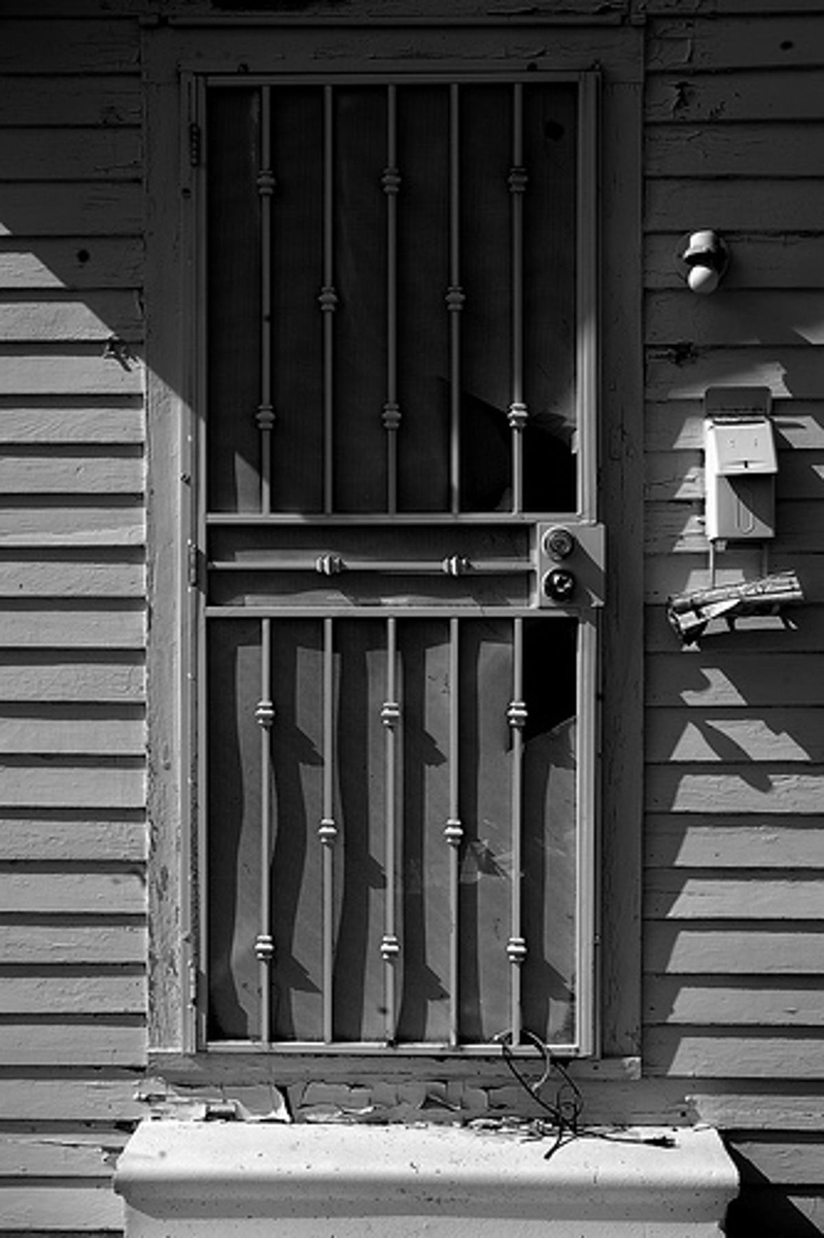 The 3 billionth photo at Flickr is this shot of a door on an abandoned house in New Orleans' Lower Ninth Ward.