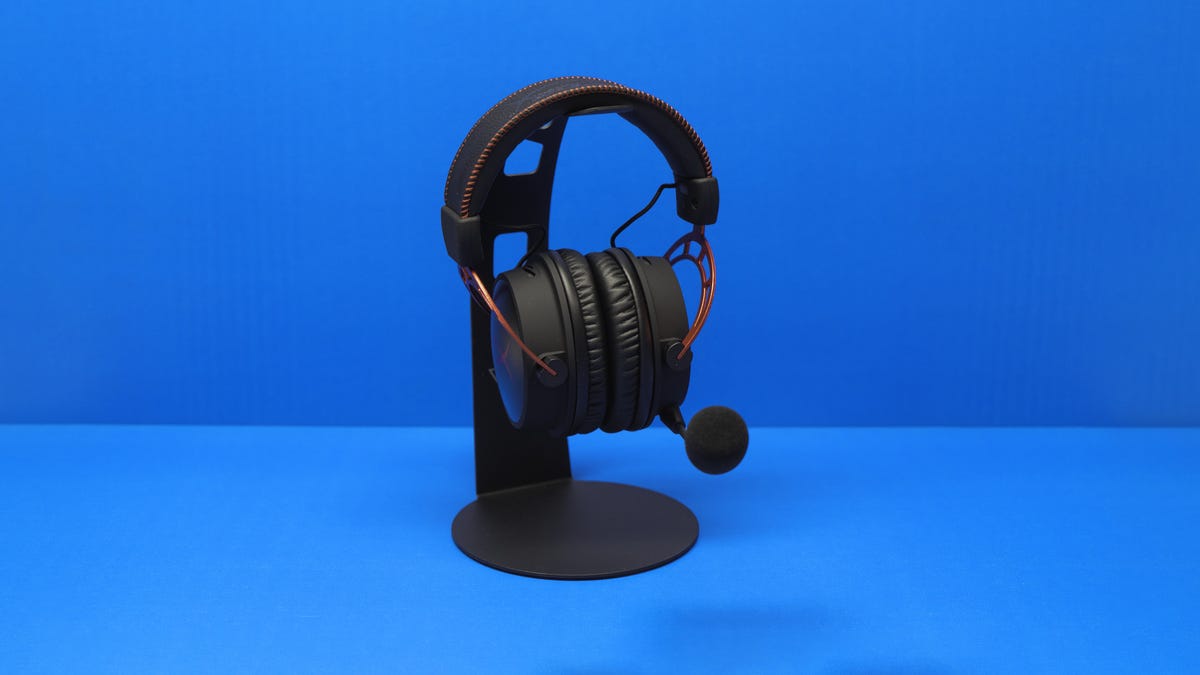 HyperX Cloud Alpha gaming headset against a blue background.