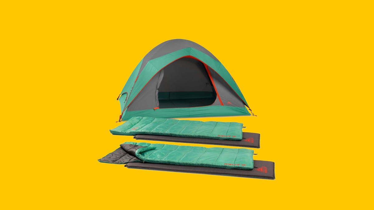 A teal, gray and red tent with two sleeping bags next to it on a yellow background