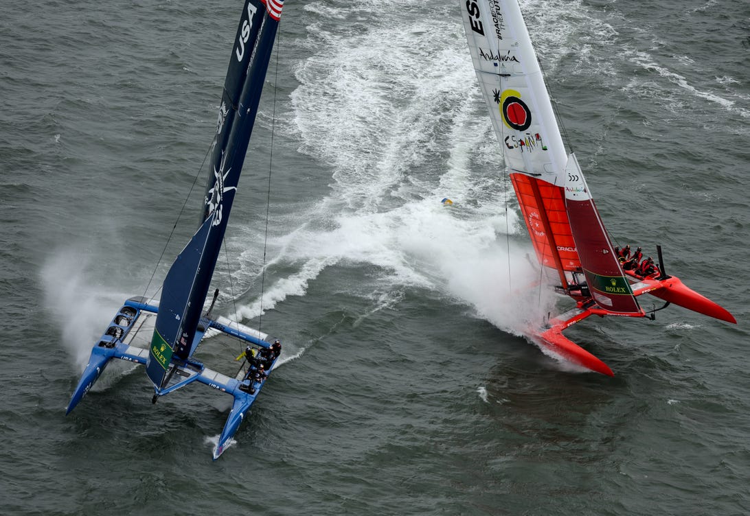 The US and Spanish SailGP boats collide on the water during grand final racing.