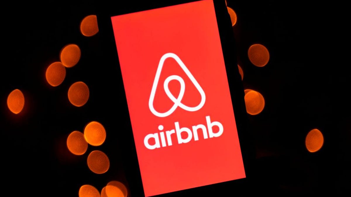 Airbnb logo on a tablet screen