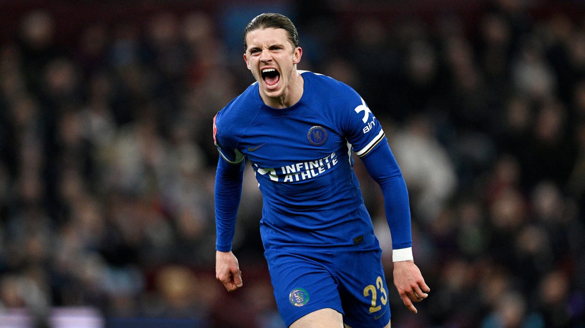 Chelsea midfielder Conor Gallagher celebrating, shouting, leaning forward.