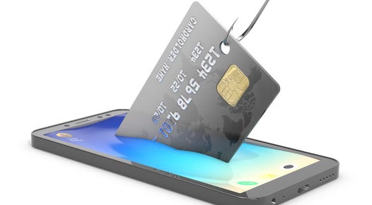 An image of a credit card being pulled out of a smartphone by a fishhook.