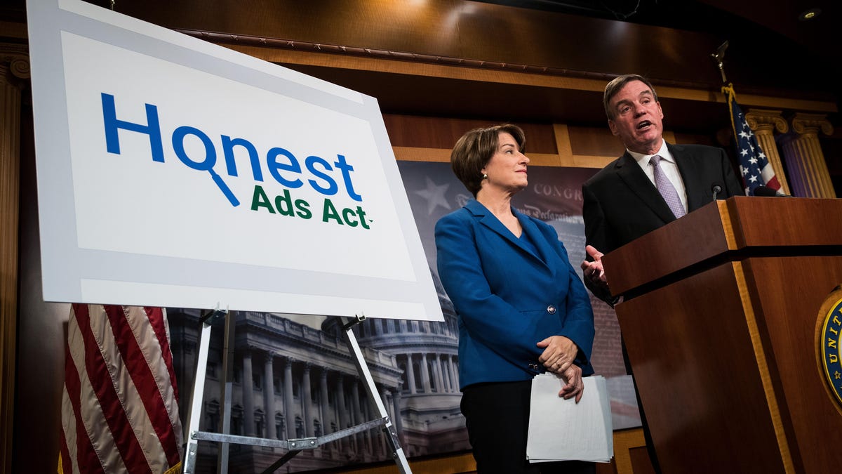 Senators Amy Klobuchar and Mark Warner introduce the Honest Ads Act on Capitol Hill on Oct. 19, 2017.