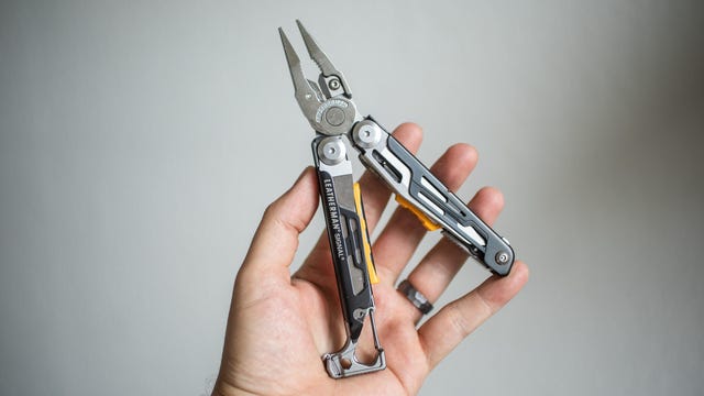 Image of hand holding a Leatherman multi-tool