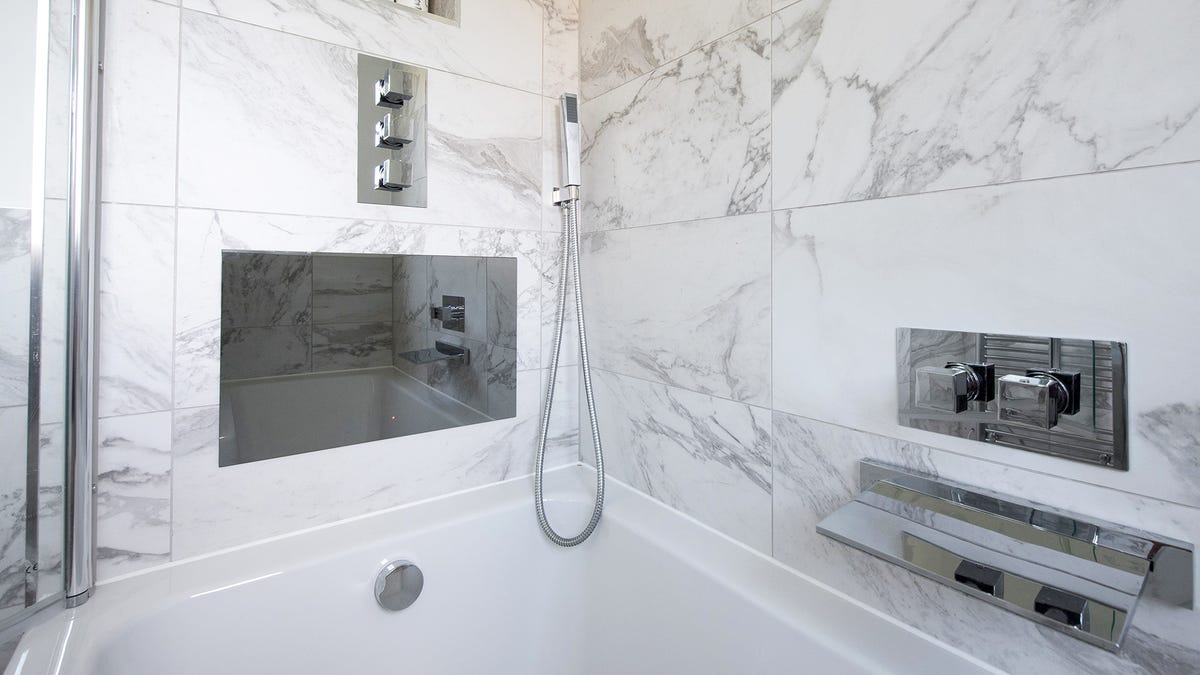 A tub/shower combo with a screen installed