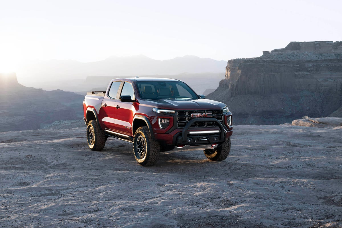 2023 GMC Canyon AT4X Edition 1 in red being shown at sunset