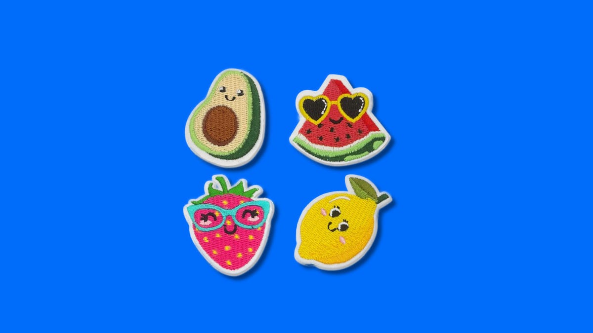 Avocado, strawberry, watermelon and lemon iron patches on blue background