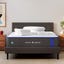 The Nectar Hybrid mattress with two wooden nightstands beside it and an abstract painting on the wall.
