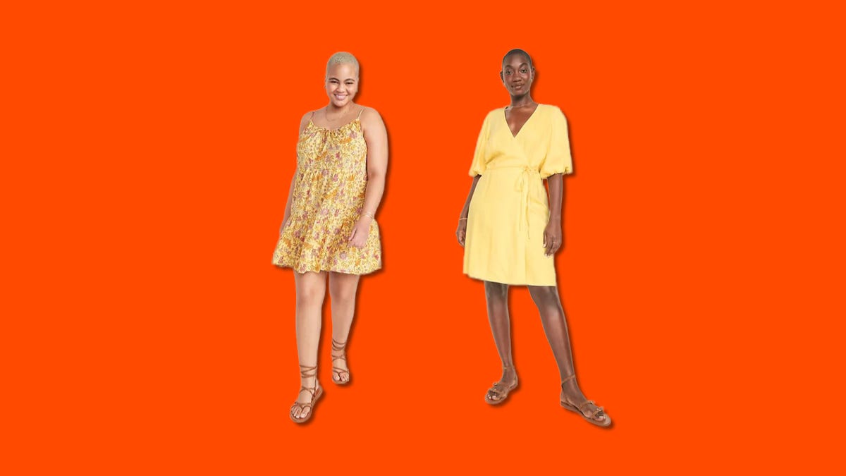 Two women posing in dresses