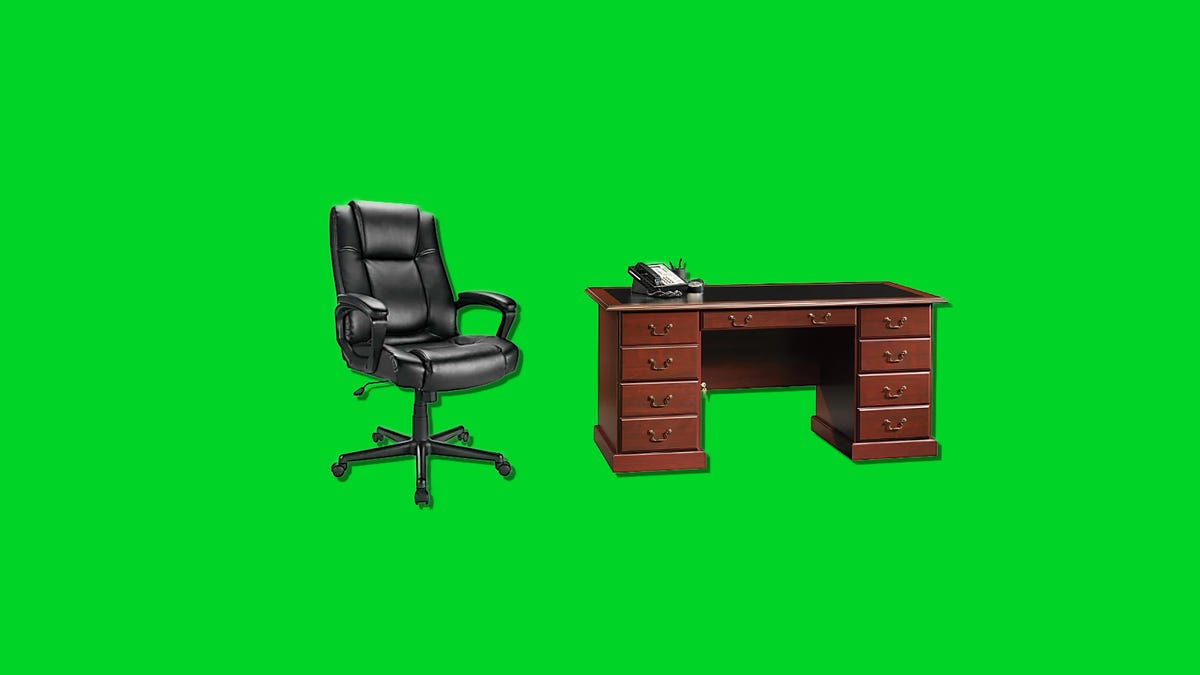 A leather executive chair and a executive desk on a green background