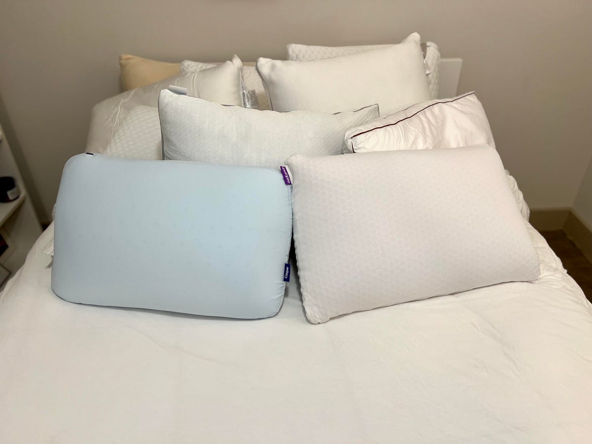 The best cooling pillows on top of a white bed