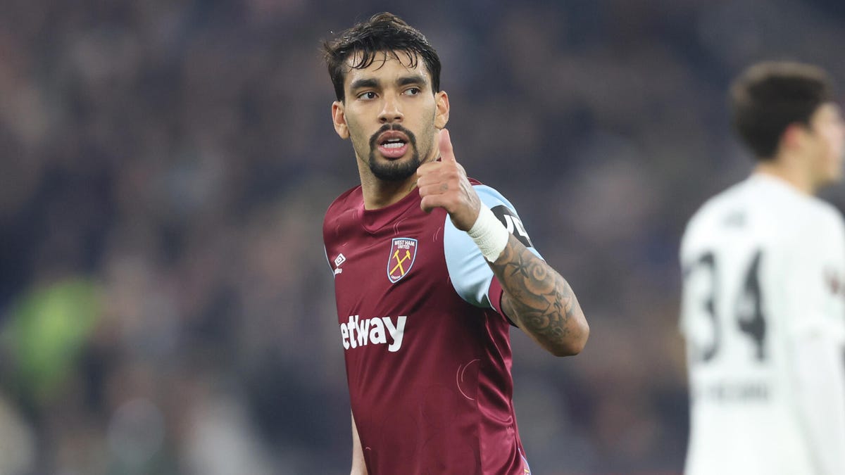 West Ham United midfielder Lucas Paqueta looking to his right,making a 