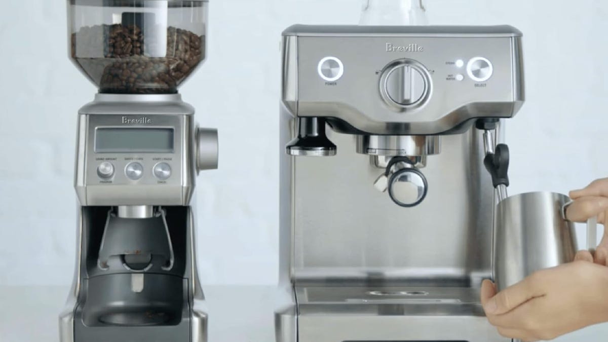 espresso machine next to coffee grinder