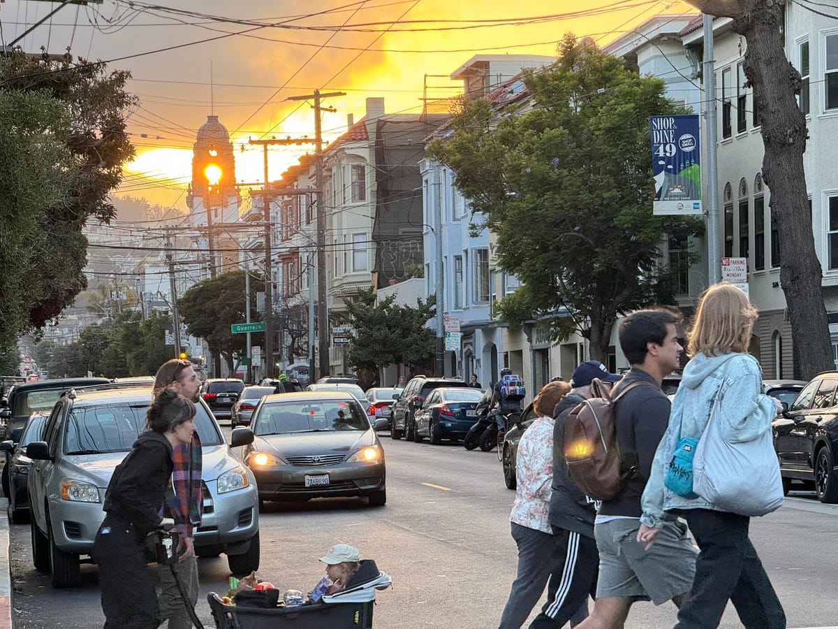 People walking at sunset